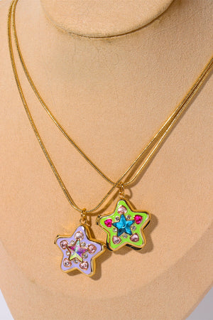 Locket starburst pendant necklaces in lavender and yellow-green with crystal accents on gold chains.