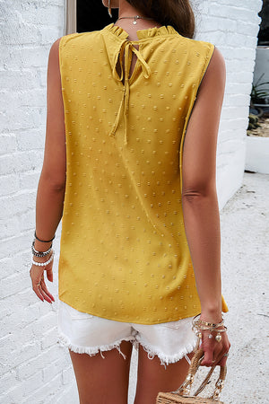 Yellow textured yoke dot tank top with ruffled neckline and tie back detail.