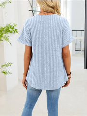Light blue ribbed knit short sleeve t-shirt with curved hem and decorative buttons.