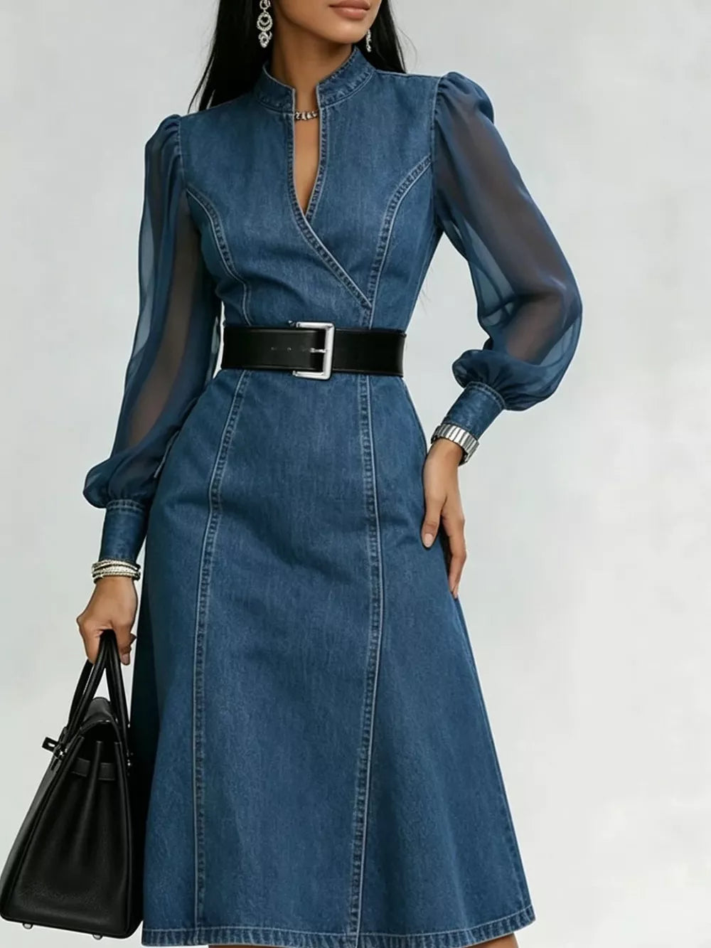 Denim midi dress with sheer puff sleeves, V-neck, and belted waist.