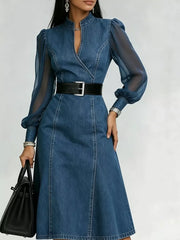 Denim midi dress with sheer puff sleeves, V-neck, and belted waist.
