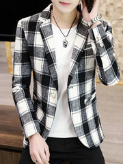 Men's black and white plaid blazer with button closure and detailed cuffs.