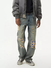 Distressed blue denim wide leg jeans with plaid patches, men's vintage style.