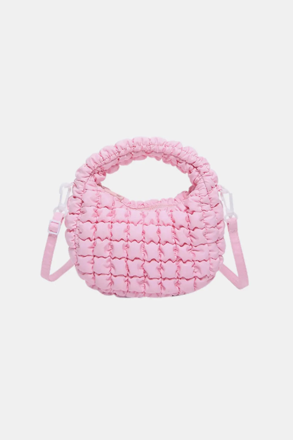 Pink padded crescent crossbody bag with sculptural texture and ruched handle