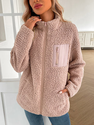 Teddy fleece jacket in light pink with zip front and patch pocket detail.