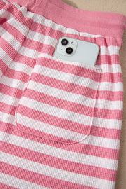 Puffed sleeve striped two-piece ensemble in strawberry pink waffle knit with drawstring waist and pocket detail.