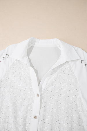 White eyelet blouse with embroidered detail and poet sleeves.
