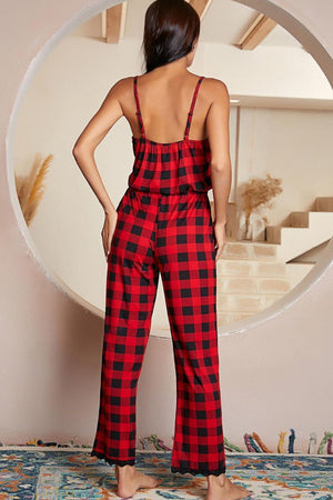Red plaid cami jumpsuit with lace trim and adjustable straps.