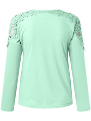 Light green long sleeve top with lace yoke and sleeve detail