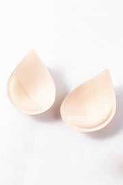 Apricot teardrop bra inserts with textured surface