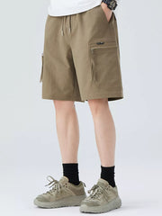 Men's camel cargo shorts with zippered pocket and drawstring waist.