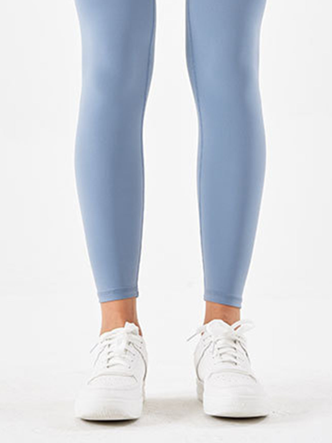 Misty Blue high-waist leggings with white sneakers