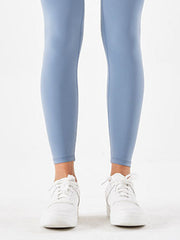 Misty Blue high-waist leggings with white sneakers