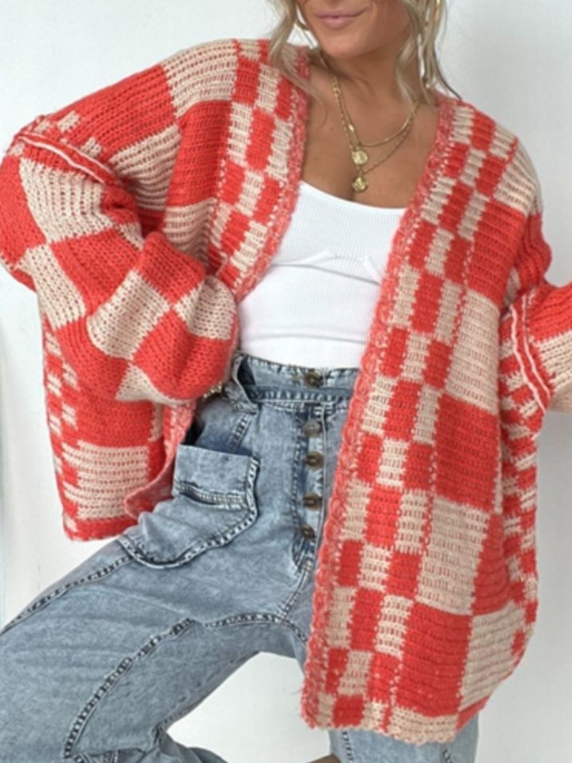 Oversized checkerboard knit cardigan in deep red and beige with a relaxed fit and open front.