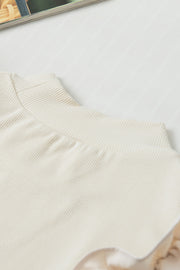 Beige ribbed mock neck top with ruffled sleeves