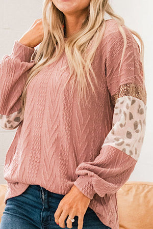 Pale blush textured chevron sweater with leopard print and sequin sleeves.
