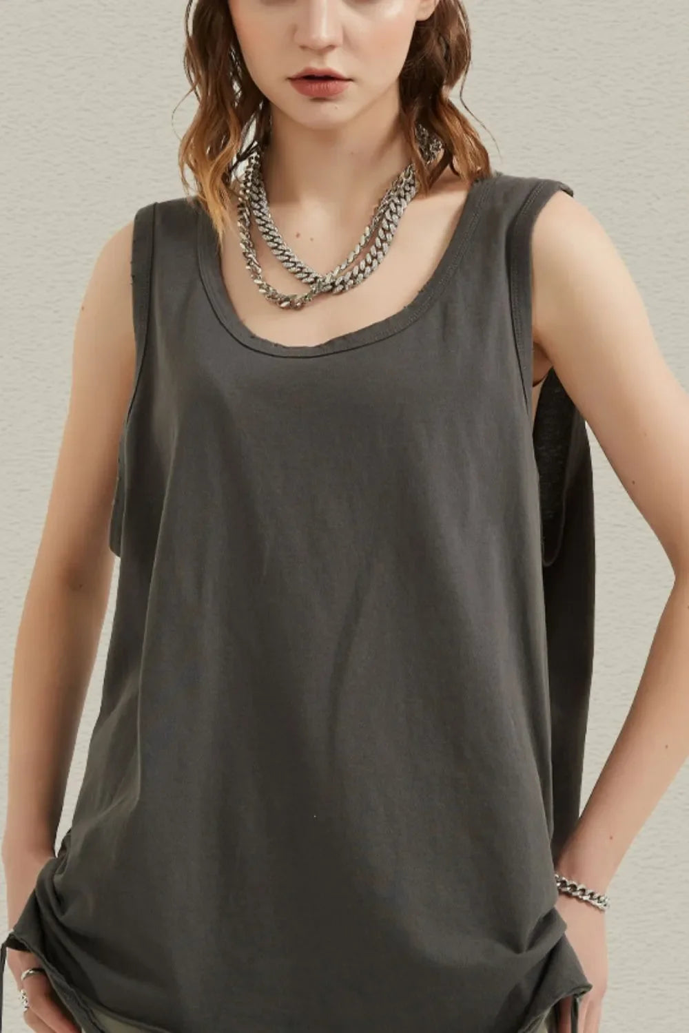Dark gray raw edge scoop neck tank top with a relaxed fit.