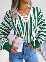 Green and white striped knit cropped pullover sweater with lace-up neckline.