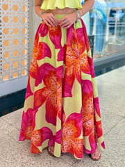 Vibrant floral maxi skirt with pockets in yellow with pink and orange lilies.
