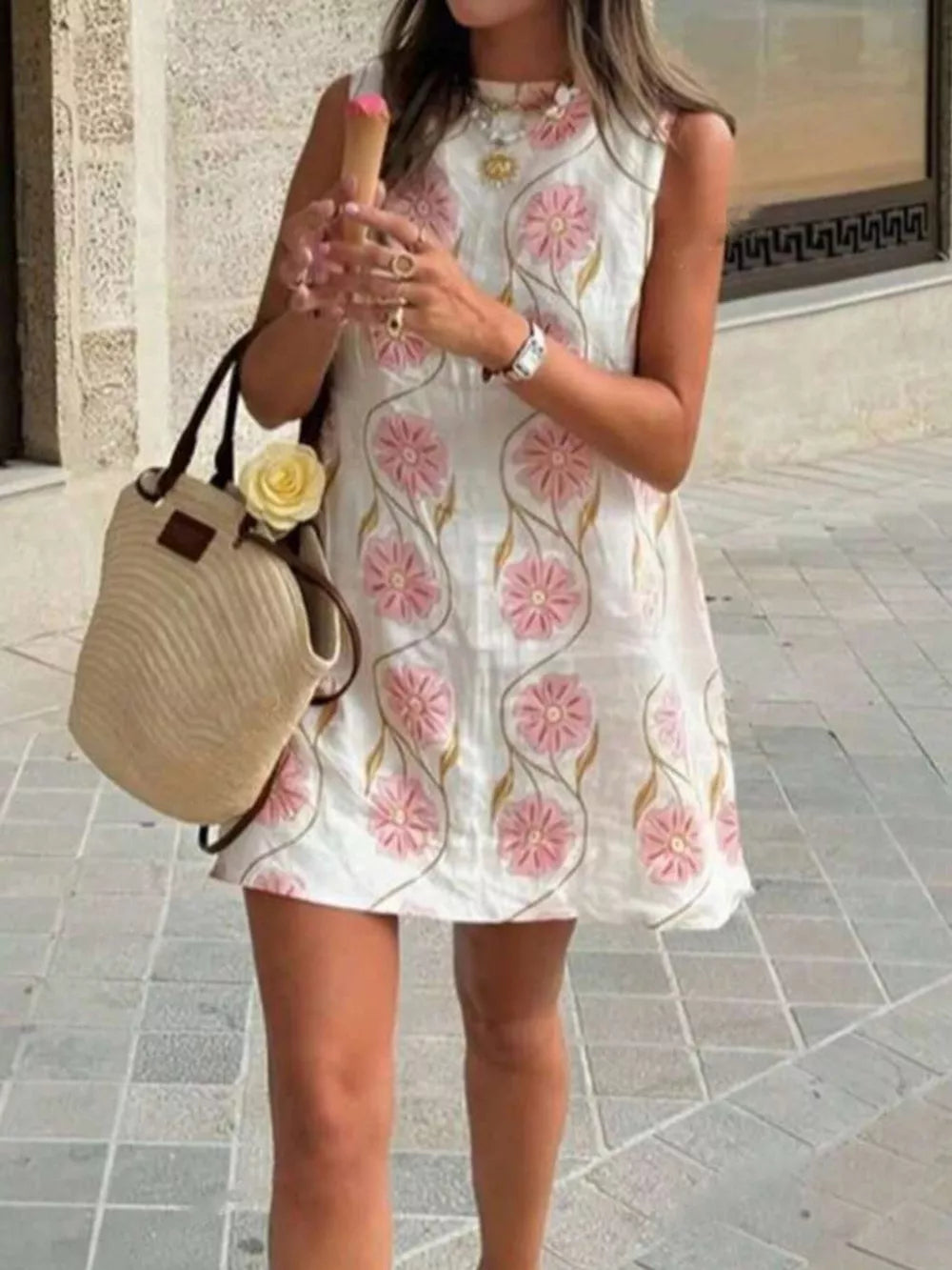 Delicate floral mini dress with high neckline in white with pink floral embroidery.