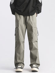 Plus-size loose fit cargo pants in green with drawstring waist and multiple pockets.