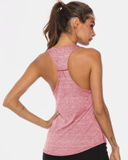 Racerback performance tank top in heathered blush pink with a curved hem.