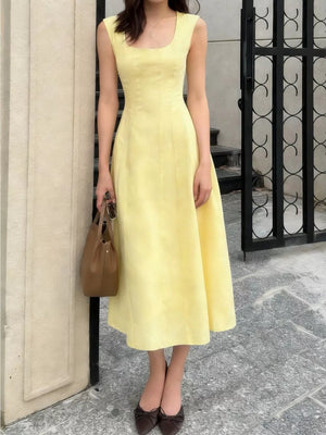 Sleeveless yellow a-line midi dress with square neckline and subtle seams.