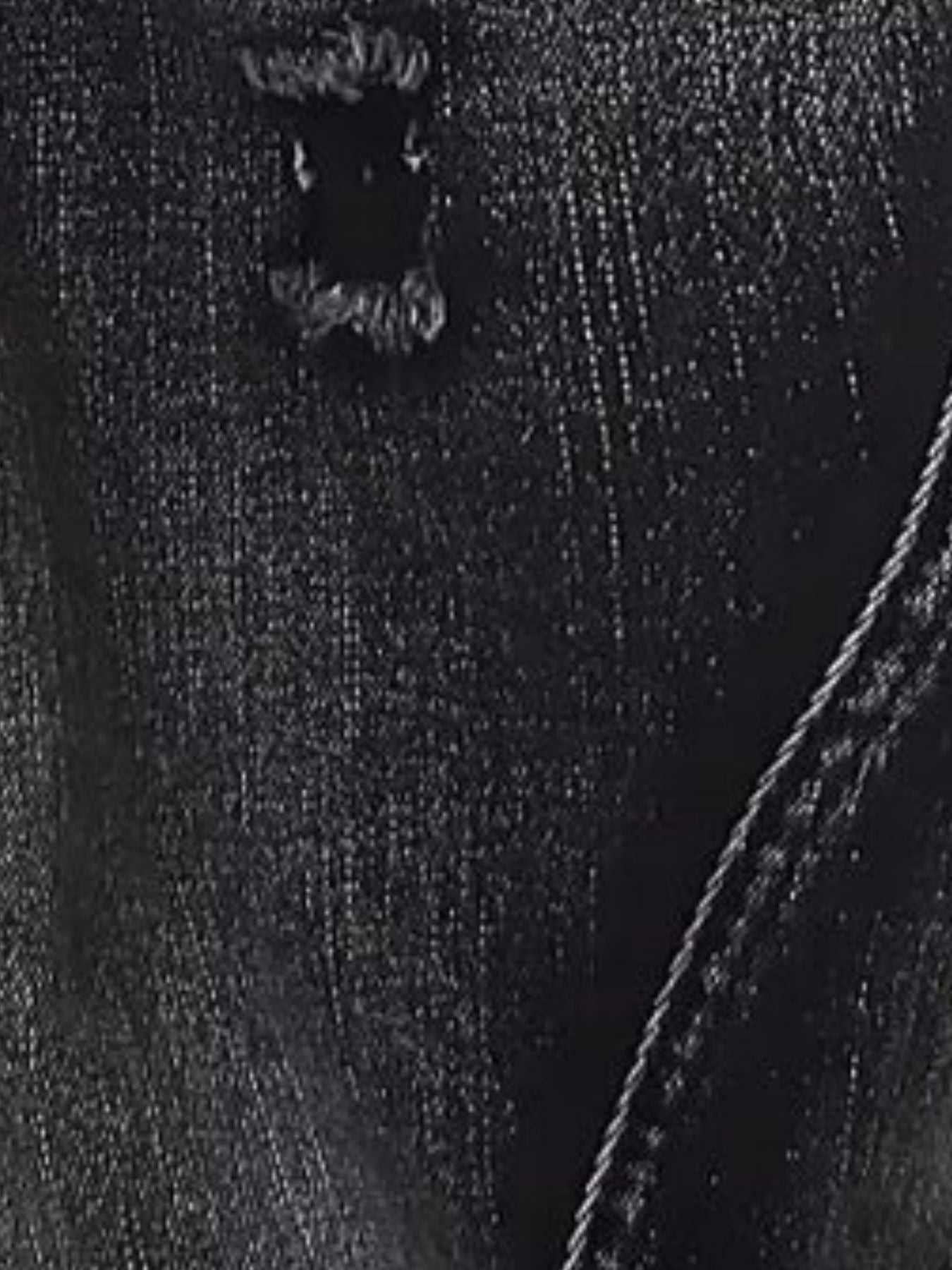 Men's dark wash cotton jeans with distressed detailing and wide-leg cut.