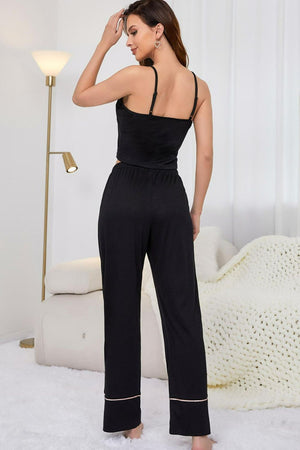 Black cami and lounge pants set with contrast trim on pants.