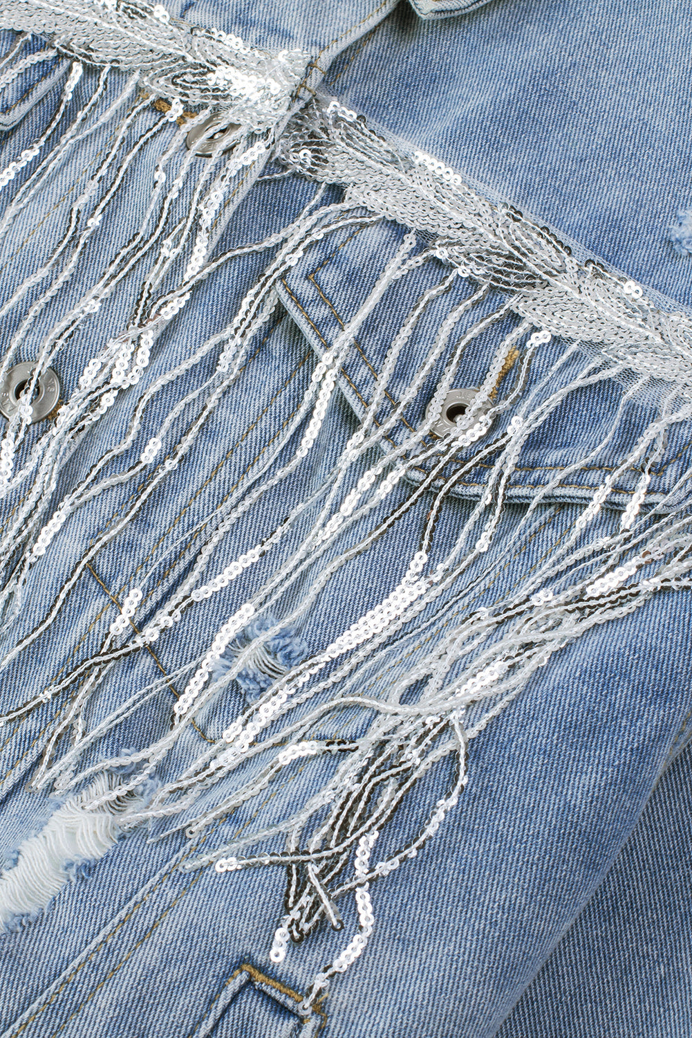 Denim trucker jacket with sequin fringe detail in medium wash.