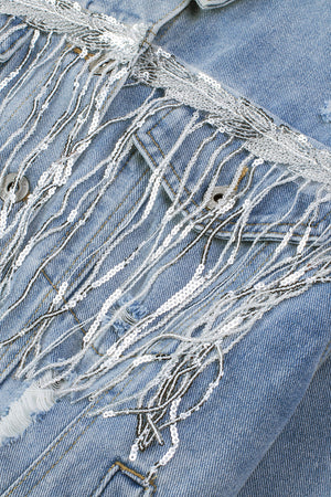 Denim trucker jacket with sequin fringe detail in medium wash.