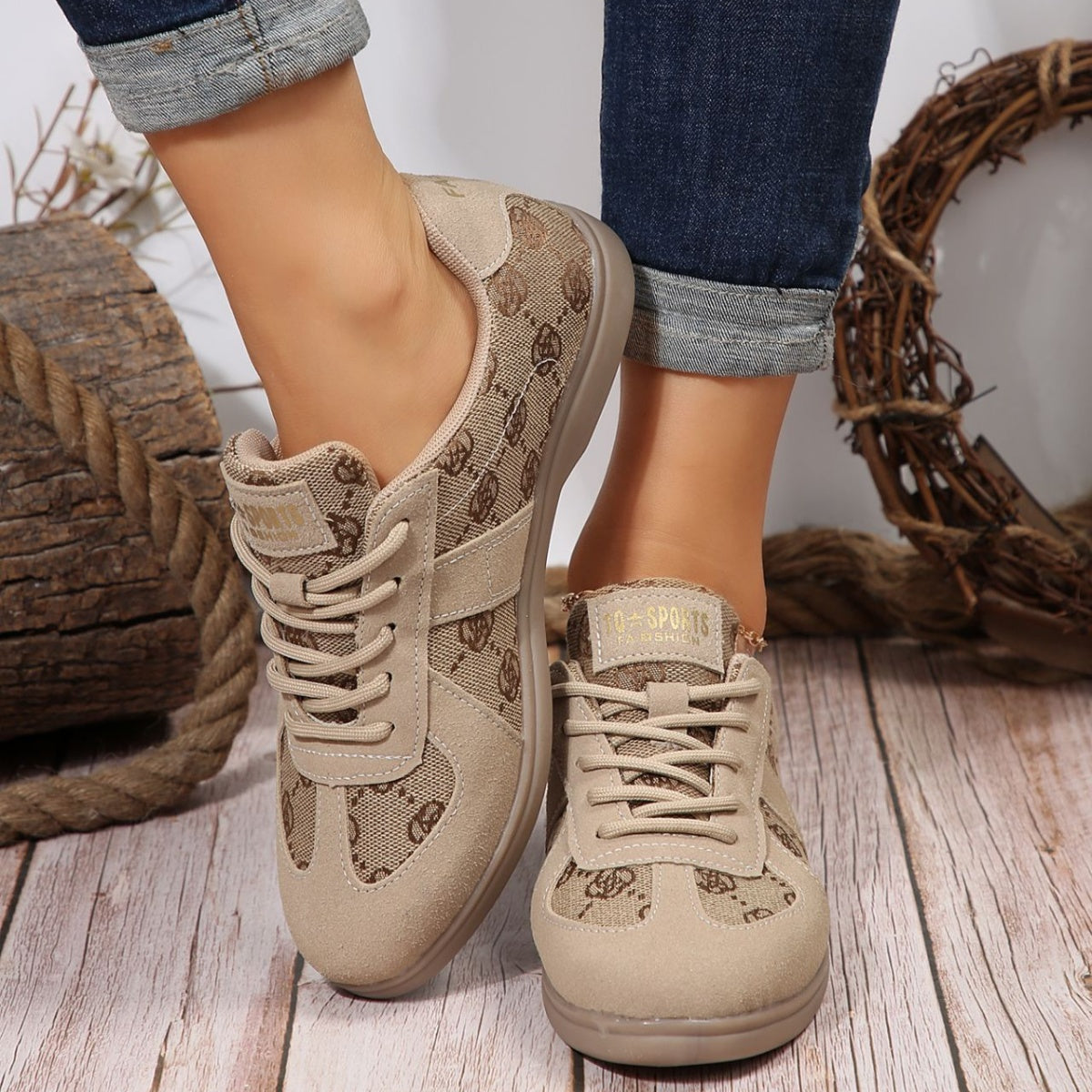 Chic beige lace-up sneakers with monogram pattern and suede accents.