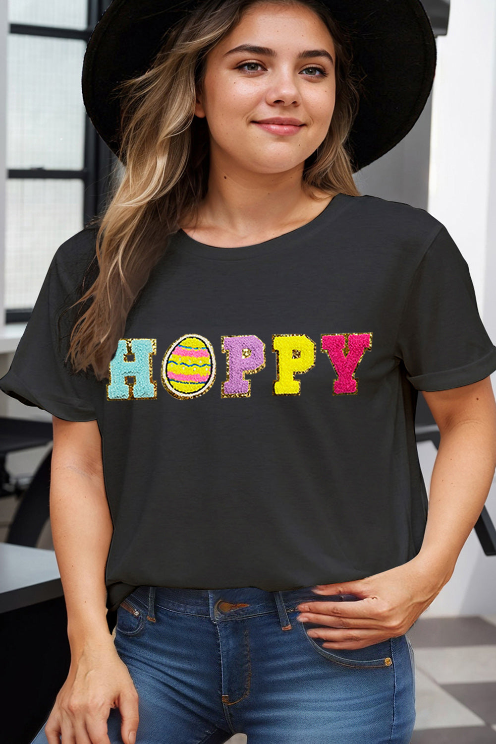 Black t-shirt with sequin "Hoppy" Easter graphic and egg detail