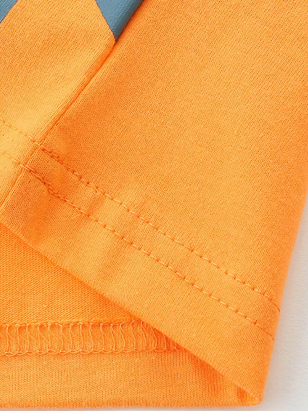 Orange cotton toddler t-shirt with blue stripe detail and reinforced stitching.
