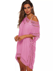 Pink crochet V-neck cover-up dress with cutout details and short sleeves.
