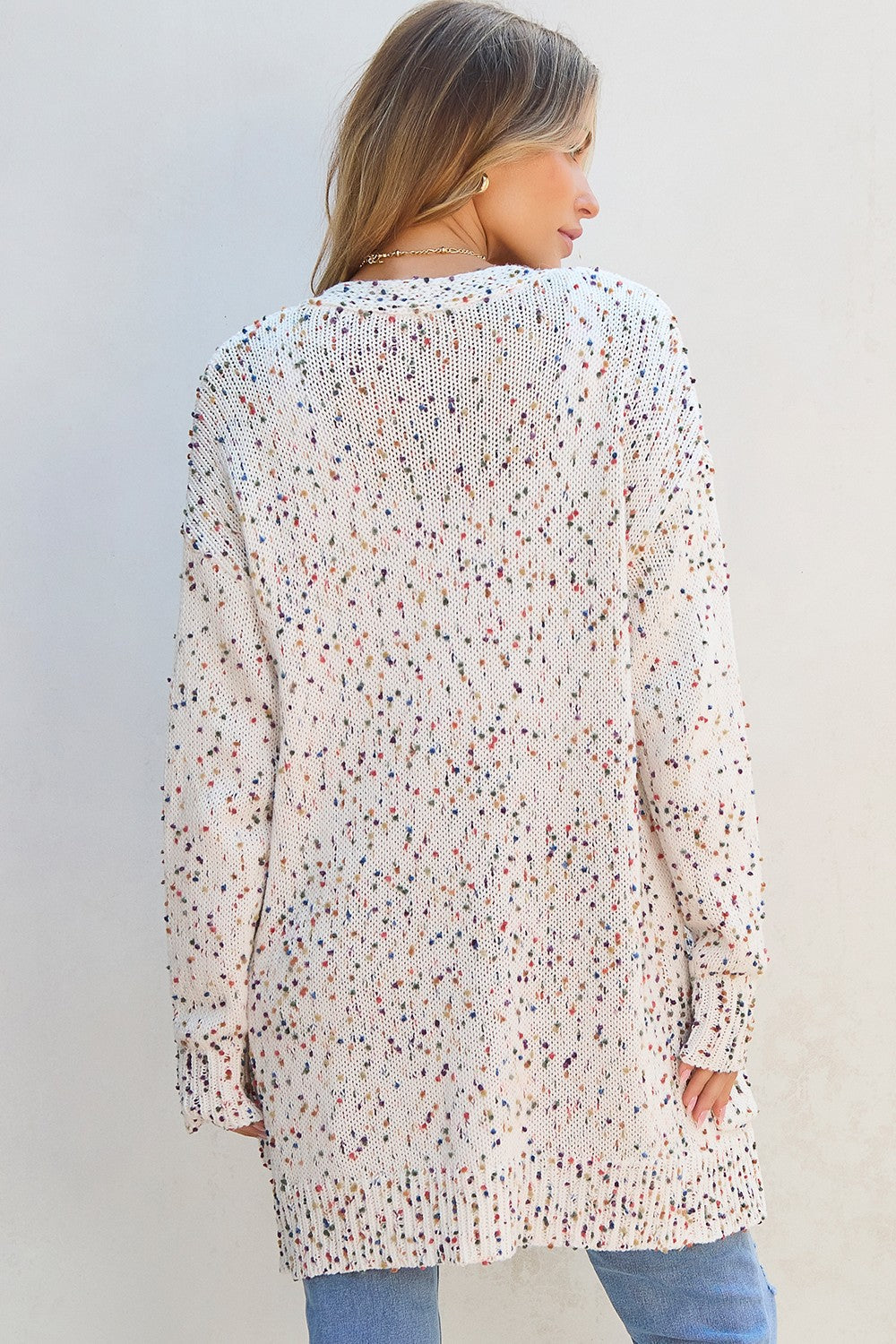Confetti knit open-front cardigan in ivory with colorful speckles.
