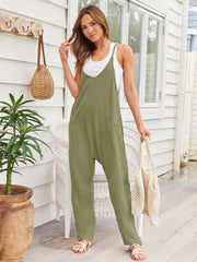 Sage green relaxed pocketed overalls jumpsuit with V-neck and wide legs.