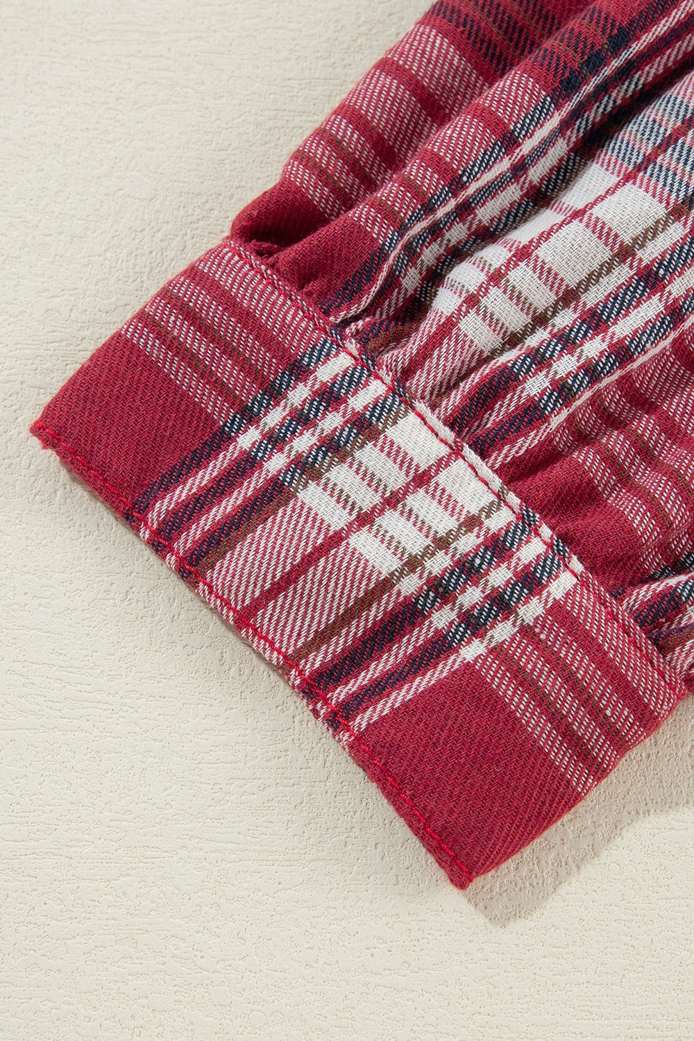 Denim plaid hybrid jacket in medium red with a distressed hooded detail.