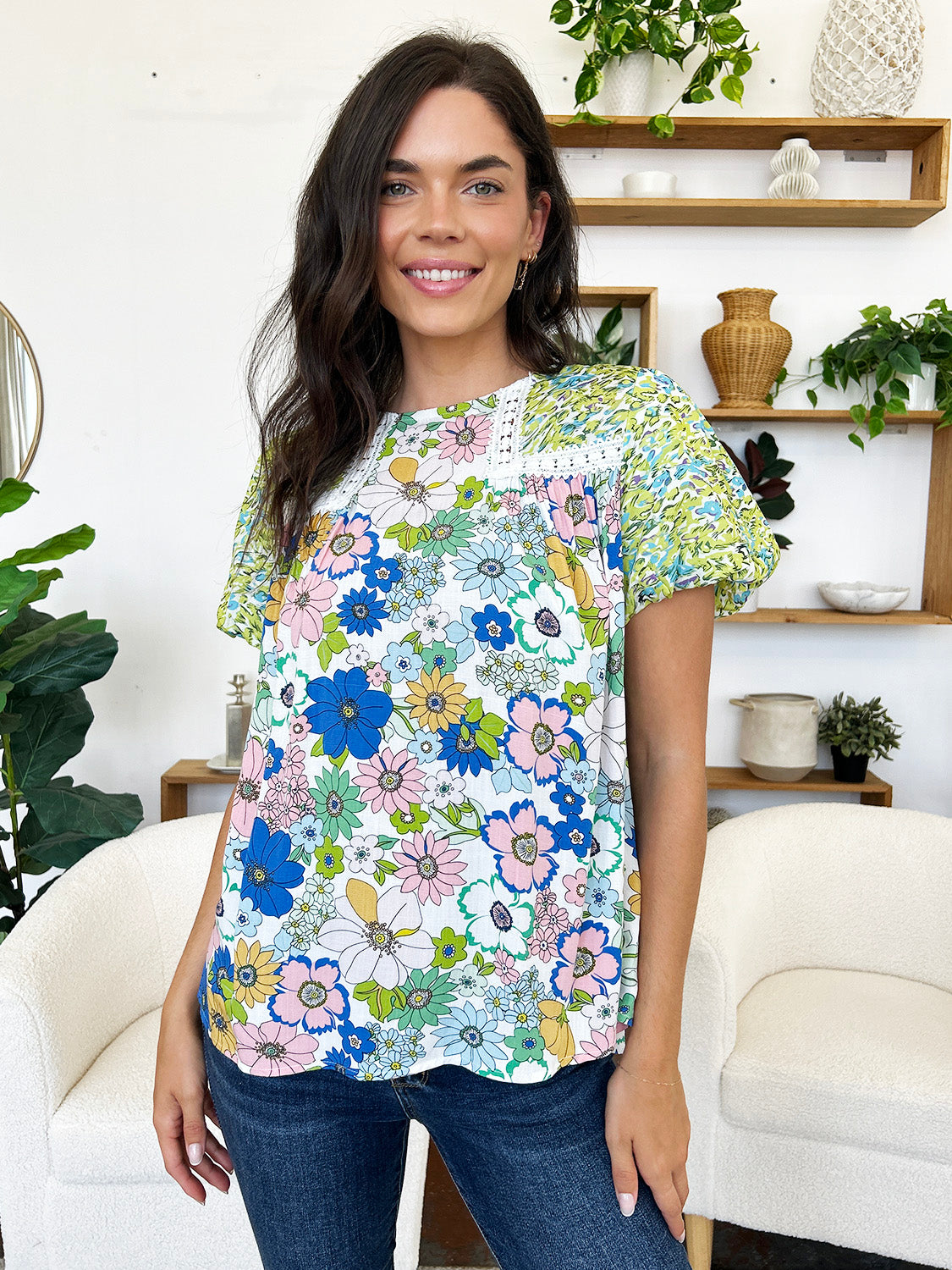 Floral patchwork puff sleeve blouse with lace trim and round neckline.