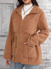 Caramel teddy fleece utility jacket with drawstring waist and chest pockets.