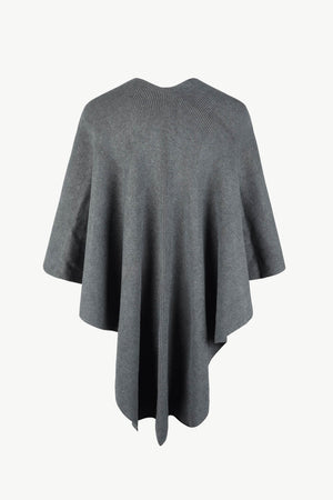 Charcoal knit cape with ribbed texture and a draped silhouette.