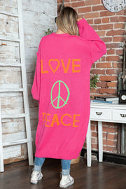 Pink maxi knit cardigan with orange LOVE and peace sign graphic, long sleeves.