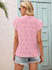 Blush pink eyelet blouse with ruffle sleeves and keyhole detail.
