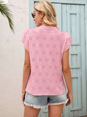 Blush pink eyelet blouse with ruffle sleeves and keyhole detail.