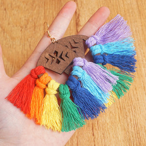 Rainbow fan tassel earrings with wooden detail and gold hook.