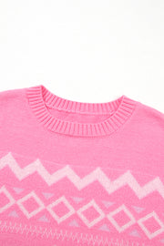 Pink acrylic knit sweater with geometric colorblock pattern and crew neck.