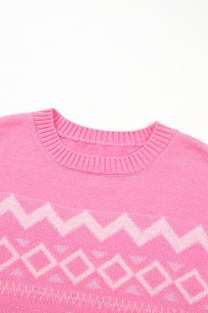Pink acrylic knit sweater with geometric colorblock pattern and crew neck.