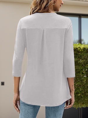 White V-neck three-quarter sleeve top with back pleat detail