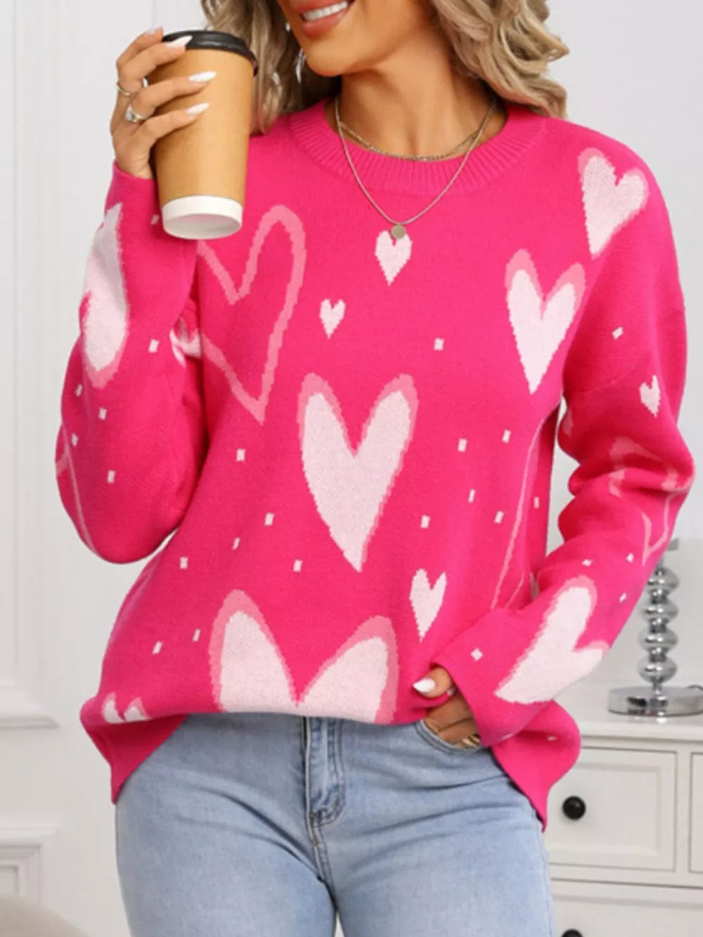 Heartfelt Fuchsia Knit Sweater with all-over heart pattern, crew neck, and long sleeves.