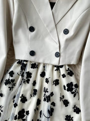 Maternity midi dress with black floral overlay and matching cream double-breasted blazer.